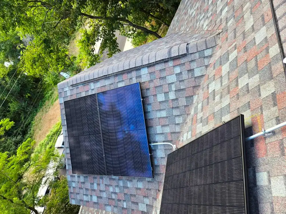 Solar modules positioned on a roof plane to keep clear of chimney and dormer shading