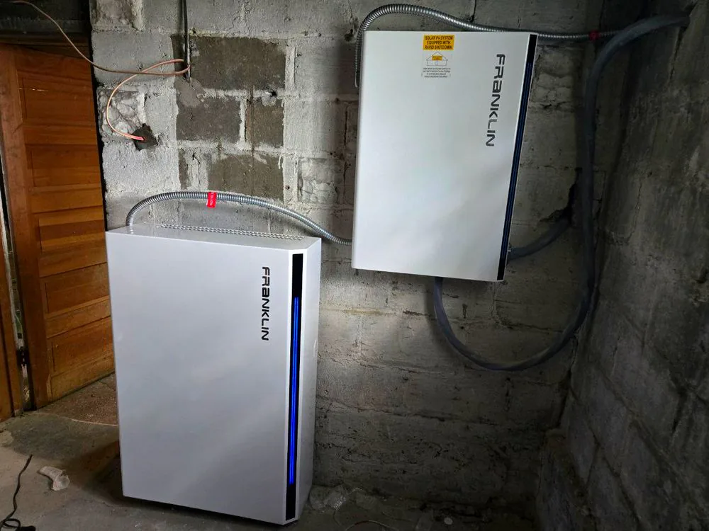 A FranklinWH aPower home battery and aGate controller installed in a basement